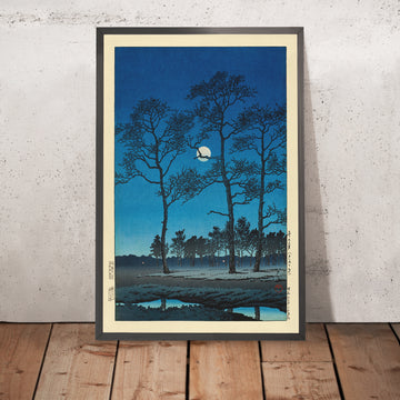 A framed image of Winter Moon over Toyama Plain by Hasui Kawase 1935