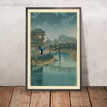 Una imagen enmarcada de la temporada de lluvias en Ryoshimachi, Shinagawa, de Hasui Kawase, 1935
